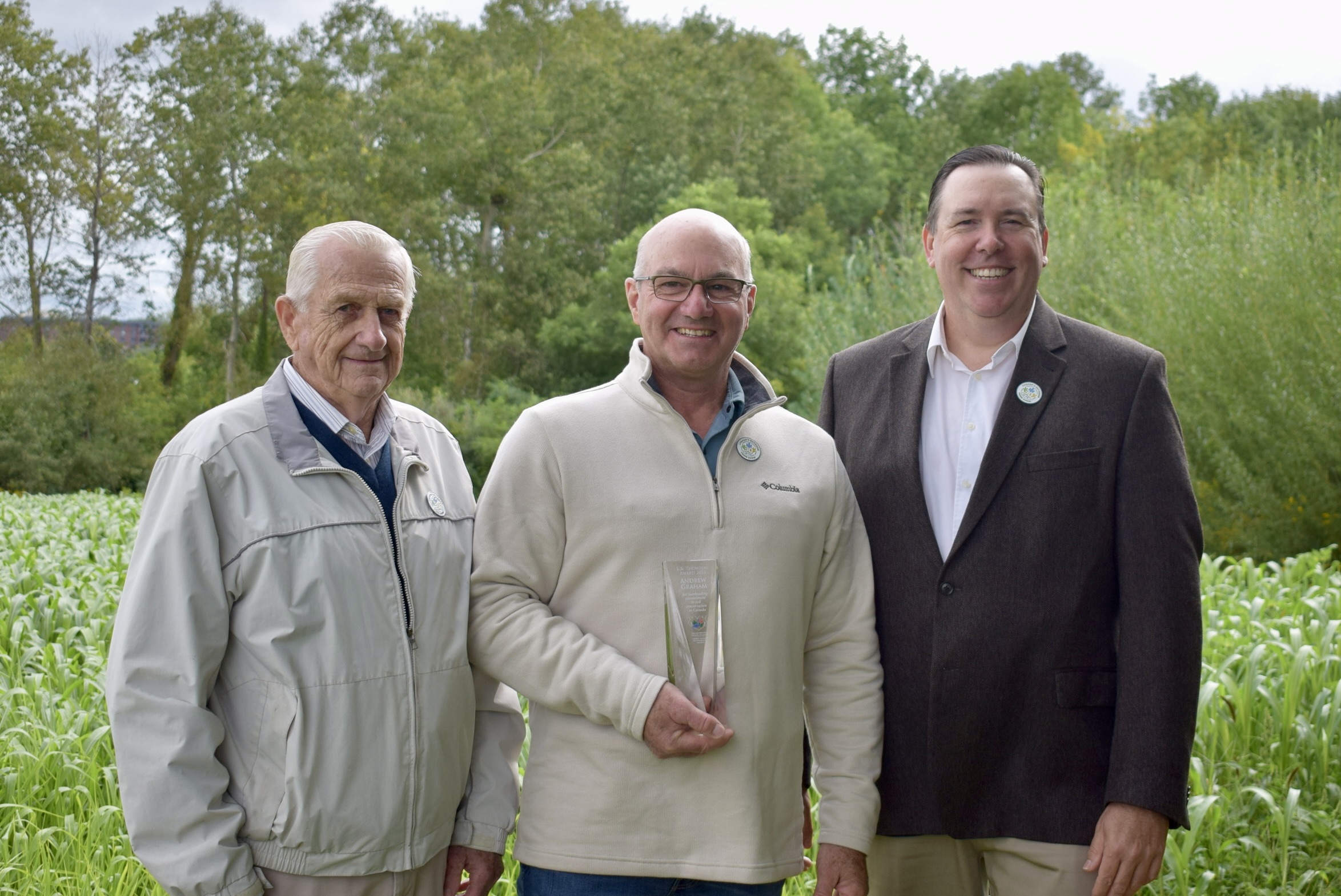 Andrew Graham, centre, is the 2023 recipient of the L.B. Thomson Award.  Don Lobb and Alan Kruszel of the SCCC are pictured with him after he received his award. 