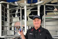 DeLaval North American business development manager Sjenk Van Soelen shows the newly developed ear tags that are central to the company's new DeLaval Plus Behavior Analysis tool that monitors in-barn cow behaviour and herd health at Canada's Outdoor Farm Show.