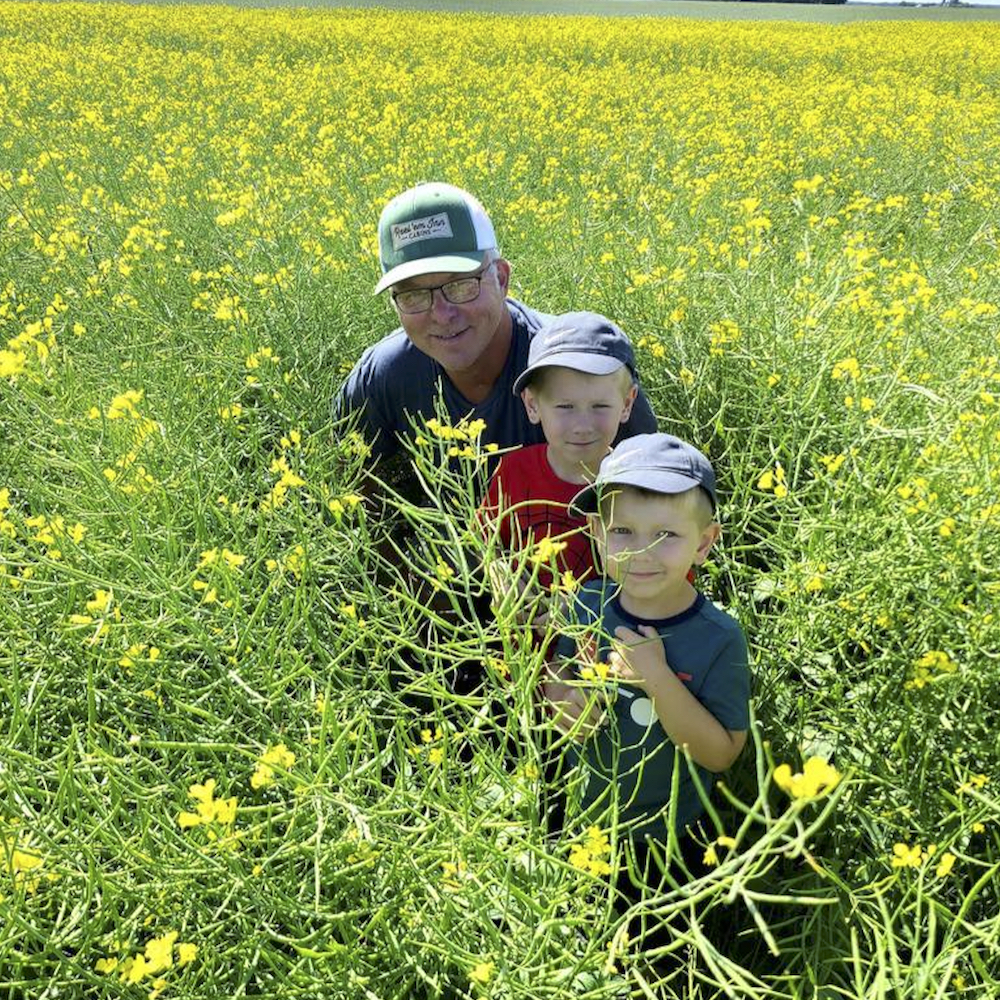 Terry Youzwa, a Saskatchewan farmer, volunteer and Ukrainian cultural ambassador, with two members of his extended family.