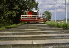 A rotary combine endures testing on the same bump track in the 1980s.