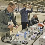 Participants at OSCIA’s annual meeting and sprayer seminar use try their hand at using various water quality tests.