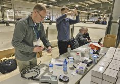 Participants at OSCIA’s annual meeting and sprayer seminar use try their hand at using various water quality tests.
