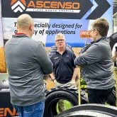 Brent Harvey of Cooksville Tire Ltd., centre, an Ascenso Tire dealer, shared the merits of the agricultural tire line during the London Farm Show. The India-produced tire is gaining traction after two years on the Canadian market.