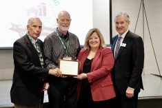 Photo caption: L-R Past chair and board member Bruce Christie presents the 2024 Food & Farming Champion Award to winner Henry Swierenga, alongside the Hon. Lisa Thompson, Minister of Agriculture Food & Rural Affairs, and FFCO Chair Crispin Colvin.