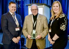 Eric Schmidt, Ontario Pork regional director, left, and Tara Terpstra, vice-chair, right, present Bob Hunsberger, centre, with the 2024 Producer Recognition of Worth.