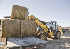 The articulated TM Series loaders combine the advantages of a light payloader with the versatility of an extended reach boom.