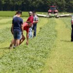 People move in to check the mowing jobs of a piece of equipment at the Ontario Forage Expo, western edition.