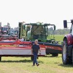 The mowers line up to cut down some hay at the Ontario Forage Expo, western edition, in Gorrie, Ont.