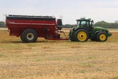 tractor and grain cart in a field