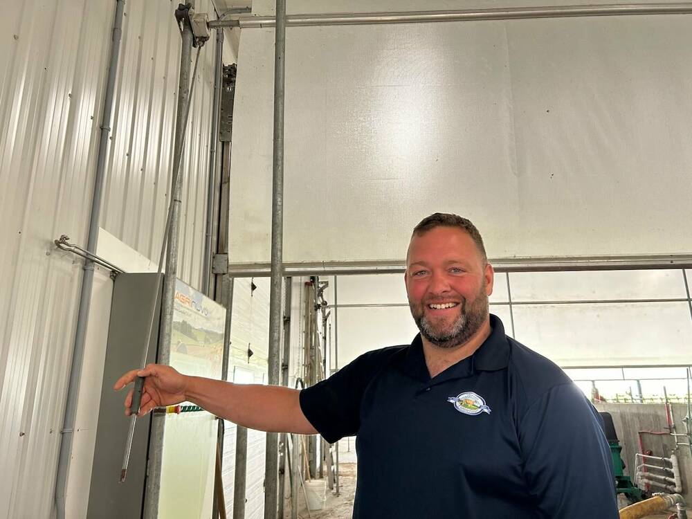 Mathieu Larose of Ferme Laroselait in Verchères shows the mechanism for lowering and raising the baffles. All that's missing is the drill to operate the mechanism. 
