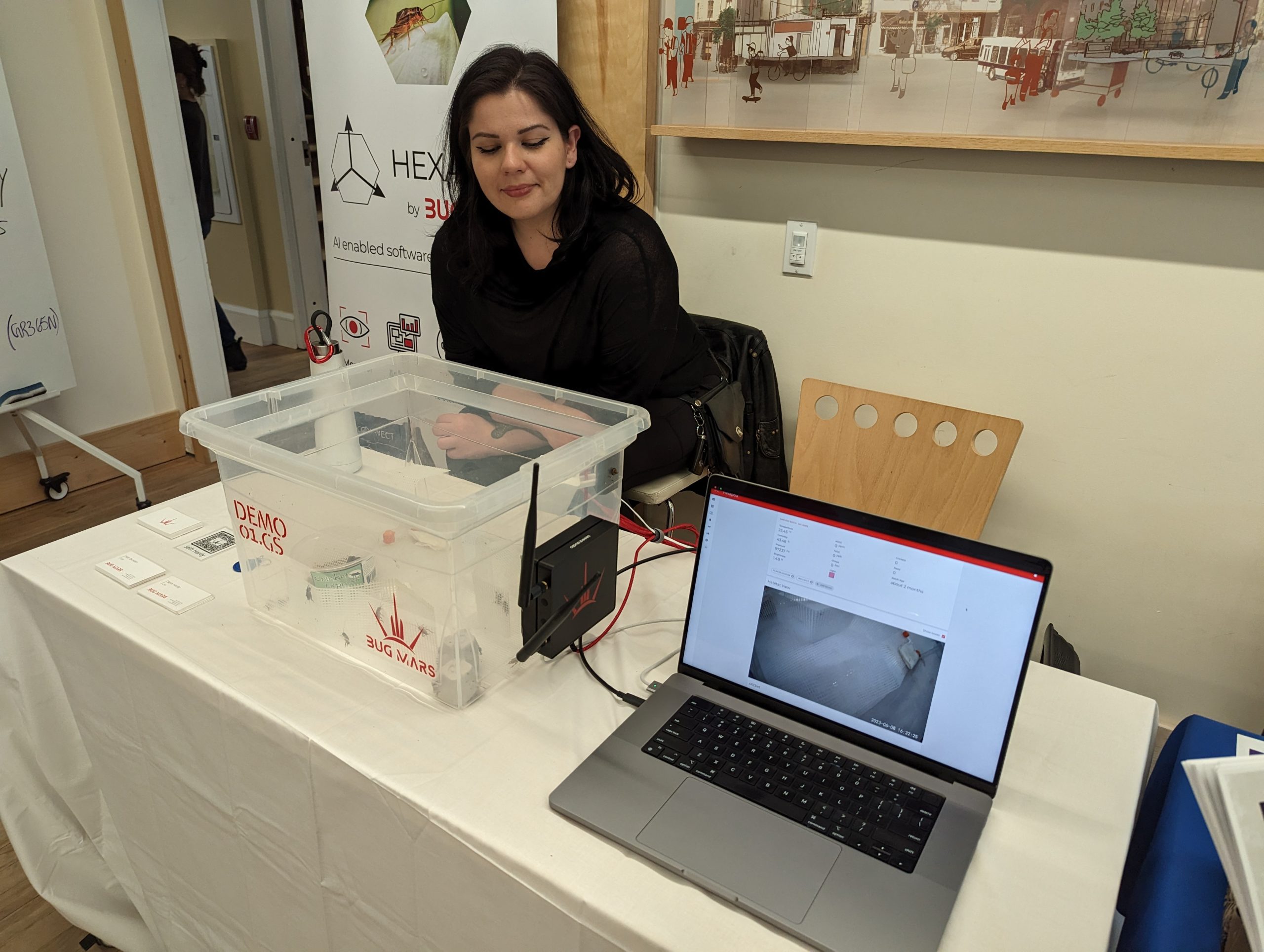 Natalie Duncan at a trade show displaying the Hexapod AI software.