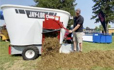 Jerry Oude Egberink, Ontario and Manitoba territory manager, releases a sheep TMR ration from the Jaylor mixer during a demonstration at Canada’s Outdoor Farm Show, Sept. 11, 2024.