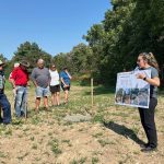 Upper Thames River Conservation Authority Agricultural Stewardship Technician Beth Wrona explains the StormTech stormwater management system to attendees at a research farm tour near Thorndale Sept. 5, 2024.