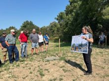 Upper Thames River Conservation Authority Agricultural Stewardship Technician Beth Wrona explains the StormTech stormwater management system to attendees at a research farm tour near Thorndale Sept. 5, 2024. 