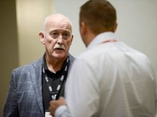 Keith Currie, Canadian Federation of Agriculture president, left, hears concerns from an Ontario Federation of Agriculture member during the provincial annual meeting Nov. 27, 2024, in Toronto. 
