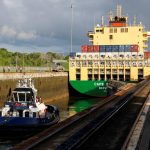 A tugboat moves behind a cargo vessel as vessels transit through the Panama Canal, in Panama City, Panama May 3, 2024. Photo: REUTERS/Daniel Becerril