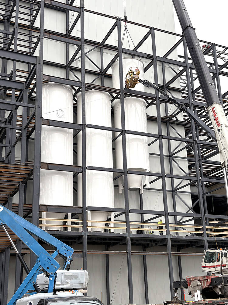 Silos are slotted carefully into place within the skeleton of Parrish and Heimbecker Milling Group’s third mill at the Hamilton port facility. 