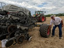 Agco marketing manager Mark Brungardt demonstrates the tire pressure adjustment system at a field demonstration in Kansas last June.