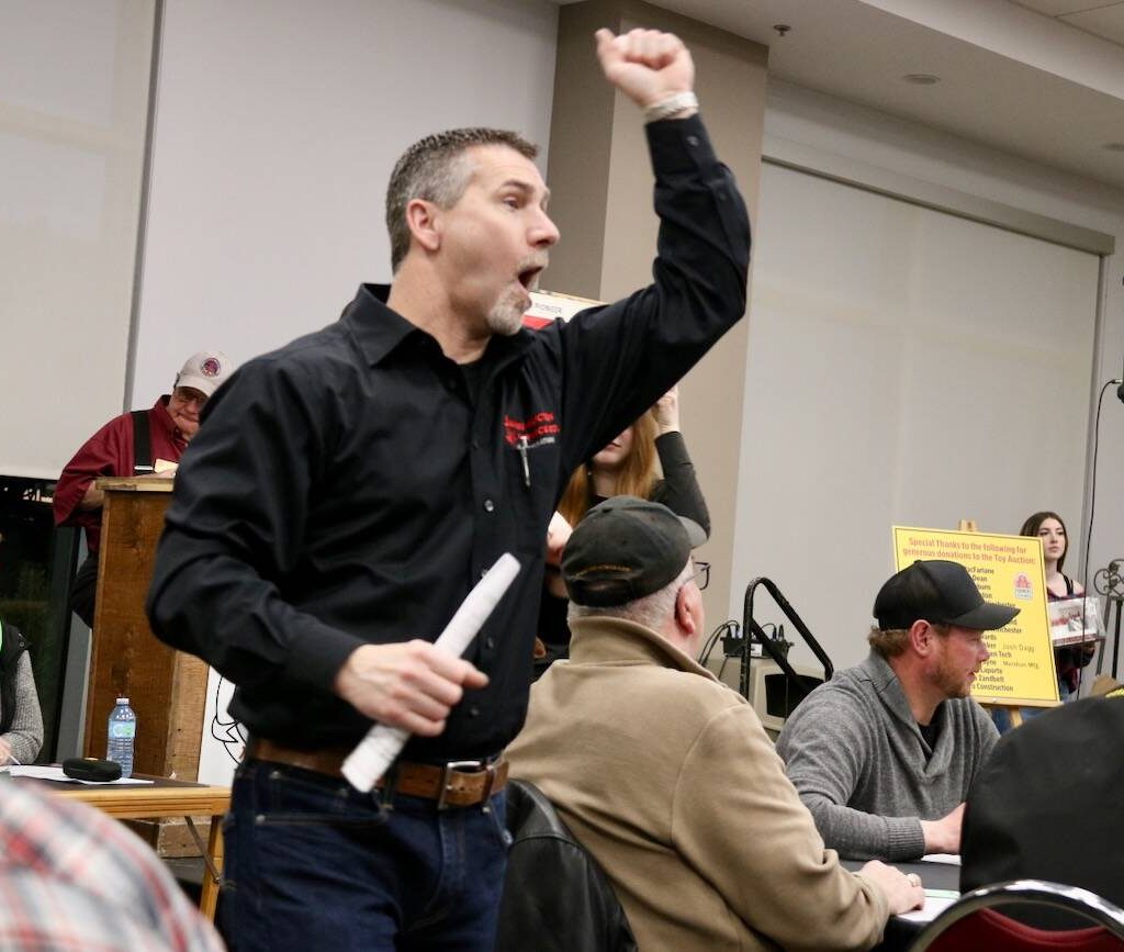 A caller hollars out a bid during the Vintage Iron and Traditions of Eastern Ontario sale at the 20205 Ottawa Valley Farm Show.