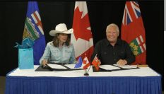 Premiers Doug Ford and Danielle Smith signed two MOUs Monday in Calgary. Screenshot taken from YouTube livestream.