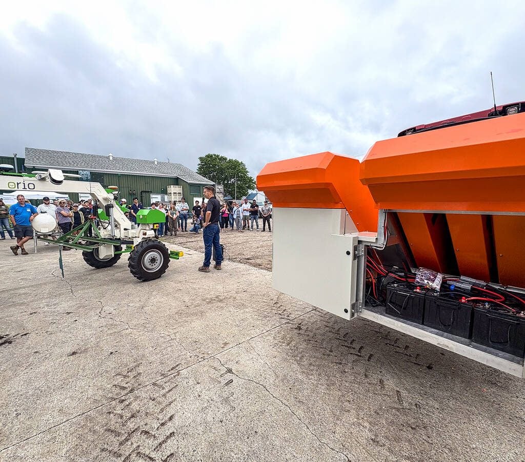 Chuck Baresich, Haggerty AgRobotics, explains how the Pixelfarming Laser One–i prototype was adapted to fit the Orio NAiO’s frame during the Ontario Crops Research Centre in Bradford on July 9, 2025. Photo:Diana Martin