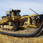 Drainage tile being installed in a farm field in Essex county, Ontario. Photo: Matt McIntosh
