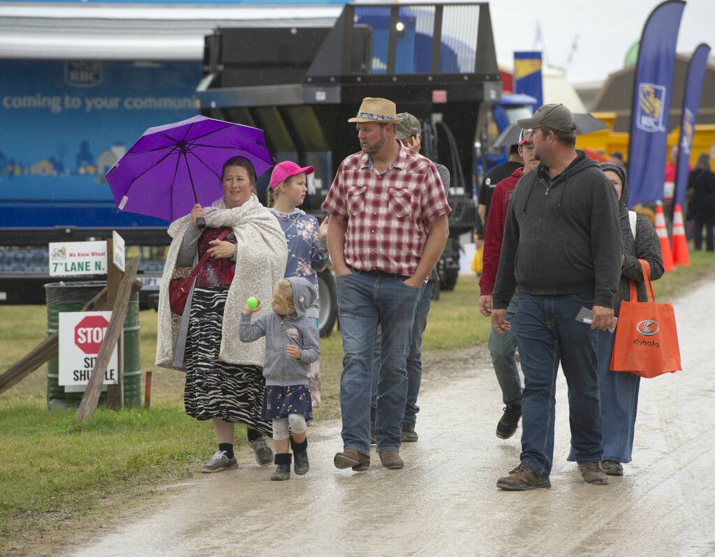 Attendees in the rain at Canada's Outdoor Farm Show