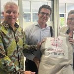 Canadian ambassador to Indonesia Jess Dutton, Brian Innes, executive director of Soy Canada and Deidre Kelly, director of the Indo-Pacific Agriculture and Agri-food Office are shown with a package of Canadian soybeans in Indonesia. Photo: Courtesy Soy Canada