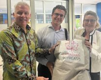 Canadian ambassador to Indonesia Jess Dutton, Brian Innes, executive director of Soy Canada and Deidre Kelly, director of the Indo-Pacific Agriculture and Agri-food Office are shown with a package of Canadian soybeans in Indonesia. Photo: Courtesy Soy Canada