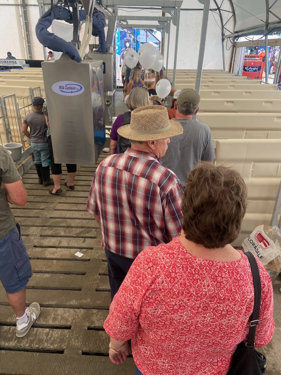 Visitors tour the calf feeding demonstration at Canada’s Outdoor Farm Show. Photo: File