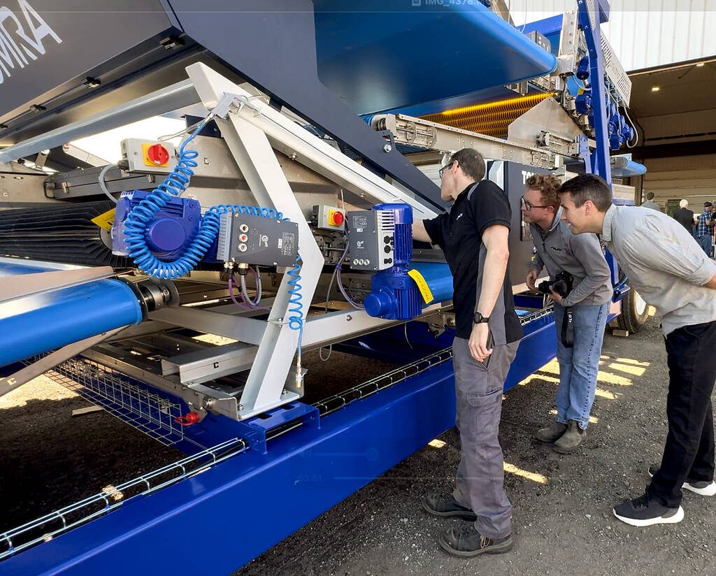 The HJV Split Grader prototype, featuring an integrated Tomra 3A optical sorter to detect and remove debris and green potatoes, drew plenty of attention during the Ontario Potato Board's Potato Field Day Aug. 21 at HJV Equipment near Alliston. Photo Diana Martin