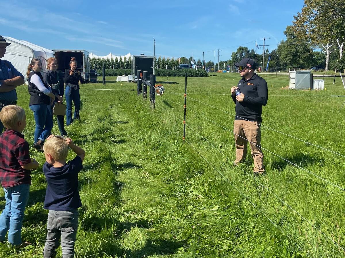 Farmers listen to the grazing demonstration at Canda's Outdoor Farm Show.