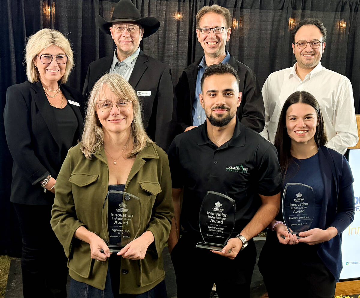 Donna Boyd, Agricultural Manufacturers of Canada president, back left, and Canada’s Outdoor Farm Show’s man in black, Rob O’Connor, show director, emceed the Innovation Program Awards on Sept. 8, 2025, the night before the Farm Show opened.
Chuck Baresich, Haggarty AgRobotics founder, back centre, won in the Equipment category. Behnam Abbasian, BioFerScience, back right, won in the Livestock category. Kristine White, Spornado CEO and co-founder, front left, took home the Agronomics award. LaSalle Agri Inc., Marketing Coordinator Amin Phoenix, accepted the Environmental Sustainability award, and Bruna Mion, Lactanet dairy production expert, captured the Business Solutions award.
