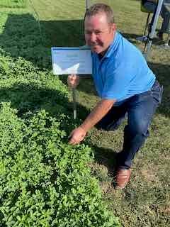 Scott Fisher, western Ontario sales manager at DLF shows off some of the alfalfa test plots at Canada's Outdoor Farm Show in Woodstock, Ontario.