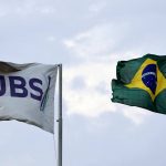 The flags of JBS S.A., the world’s largest beef producer, and the Brazil’s flag fly at a plant of JBS, in Santa Maria das Barreiras, Para state, Brazil September 12, 2025. Photo: REUTERS/Amanda Perobelli