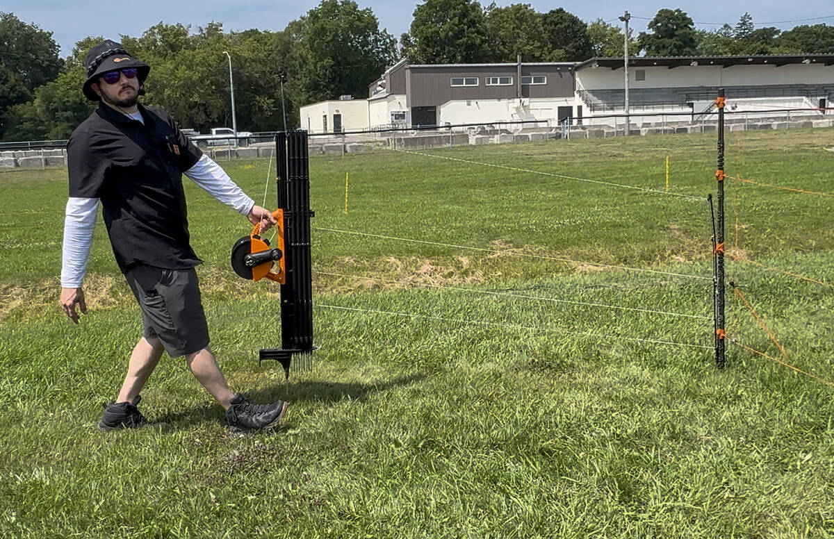 James Clark, Gallagher Animal Management’s Ontario territory manager, explains the versatility and ease of deploying Gallagher's SmartFence at the Ontario Sheep Field Day in Orono, July 24, 2025. Photo Diana Martin