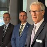 Nevin McDougall, left, of ARIO, listens at the OMAFA announcement of new funding for ARIO on Oct. 7. Also shown are Trevor Jones, Ontario's minister of Agriculture, Food and Agribusiness, centre, and Rene Van Acker, president of the University of Guelph. Photo: Diana Martin