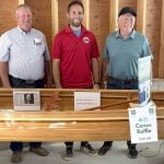 Ontario 4-H Foundation trustee, Bill Zwambag, left, and canoe builder, Ron McRae, right, presented raffle winner Danny Jefferies with the 15 foot handcrafted cedar canoe at the Idlerton Fair on Sept. 28, 2025. The raffle raised $14,580 for the Ontario 4-H Foundation's Stanley Knapp Resource Development Endowment Fund.