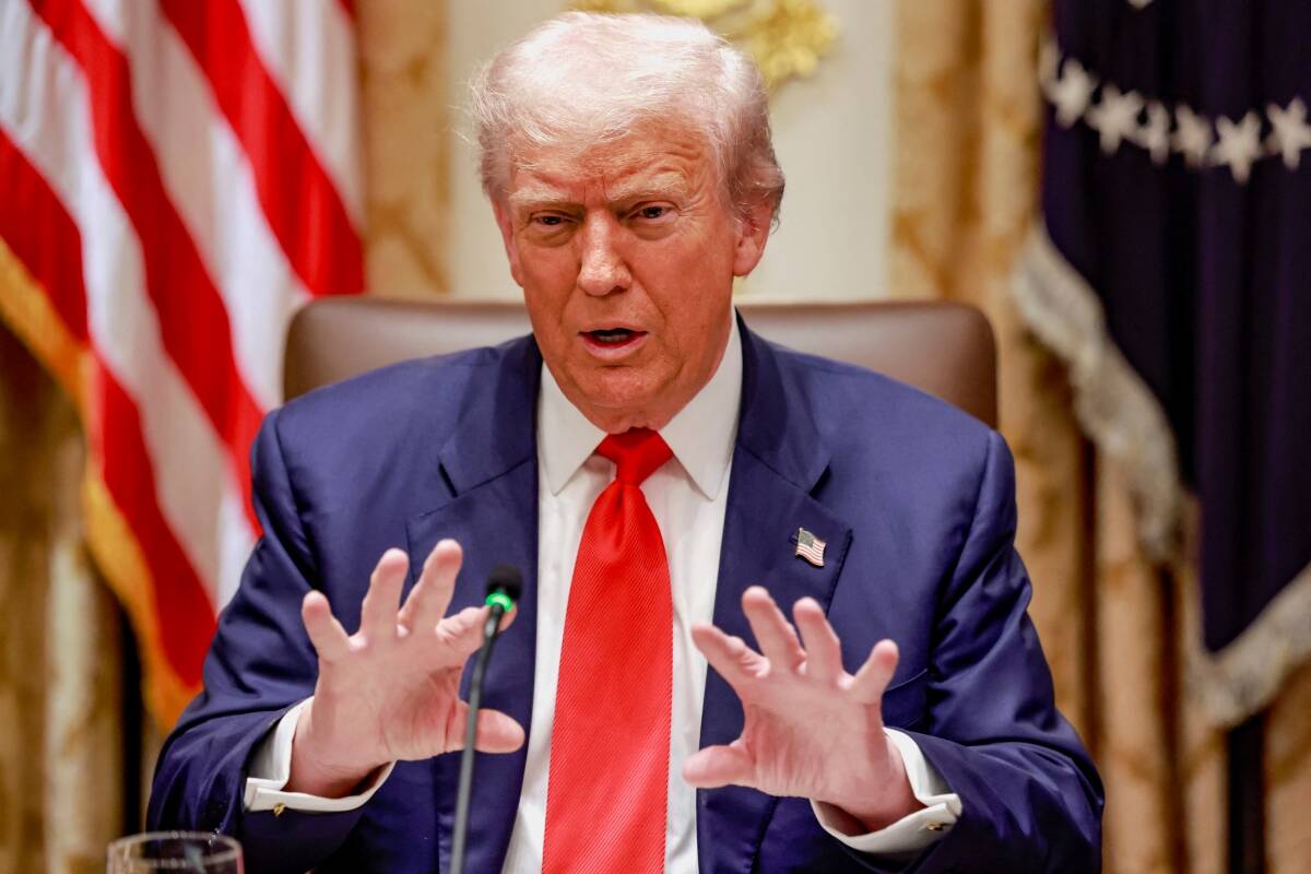 U.S. President Donald Trump gestures as he speaks during lunch with Argentina’s President Javier Milei (not pictured) in the Cabinet Room at the White House in Washington, D.C., U.S., October 14, 2025.