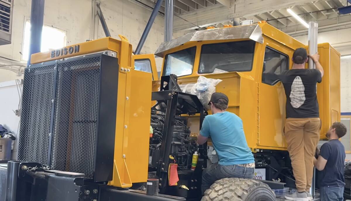 Staff work on a standard truck design that Edison builds that can be powered by the diesel-electric hybrid or standard conventional powertrain version.