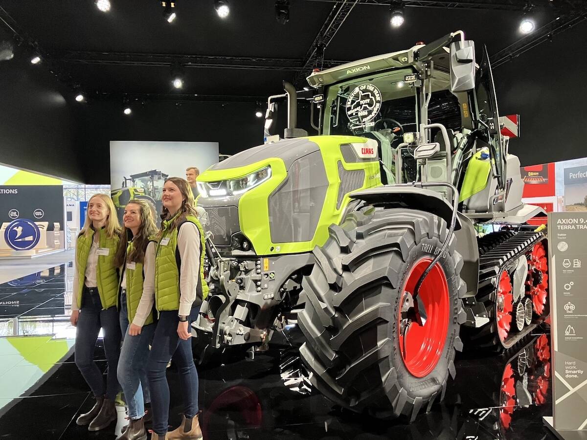 Claas team members pose by the Axion 9.450 Terra Trac tractor at Agritechnica 2025. The tractor was awarded ’Tractor of the Year’ in the HighPower category for 2026.  Photo: Greg Berg