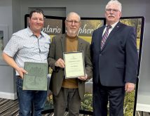 Len Hilderly, centre, was presented the Long Service award by Chris Vervoort, left and Art Alblas, Ontario Sheep Farmers chair, right, during their annual general meeting on Oct. 30, 2025 in Cambridge. Laurie Maus shared the award but was absent from the ceremony. Photo: Diana Martin