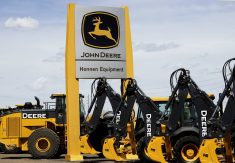 FILE PHOTO: Equipment for sale is seen at a John Deere dealer in Denver May 14, 2015. A weak global agriculture sector weighed heavily on quarterly results posted by Deere & Co on May 22, 2015, but earnings still topped expectations, and the farm equipment maker raised its full-year profit forecast despite a worsening sales outlook. Photo taken May 14, 2015.  REUTERS/Rick Wilking/File Photo