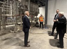 (Left) Vic Fedeli, Minister of Economic Development, Job Creation and Trade discusses the province of Ontario's $24 million investment in Alinova Canada Inc towards the construction of Canada's first non-GMO soy milk powder processing plant.