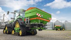 an Amazone green and orange fertilizer spreader.