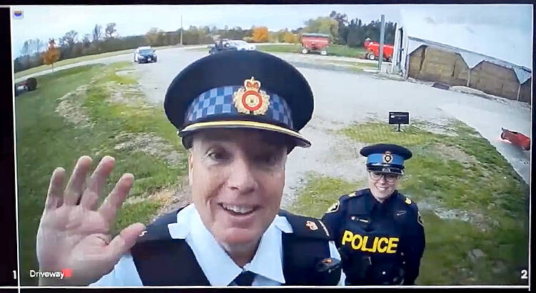 Auxiliary Inspector Brad Hull, OPP West Region regional commander, left, and Sgt. Jill Johnson of OPP West Region&rsquo;s Crime Prevention and Community Support Bureau, right, demonstrate why clear high quality video surveillance can provide critical information regarding theft and mischief on a farm or rural home during a video discussing the various steps one can take to protect their property as part of the Grey Bruce Farmers Week On-Demand session in early January.  Screengrab Image.