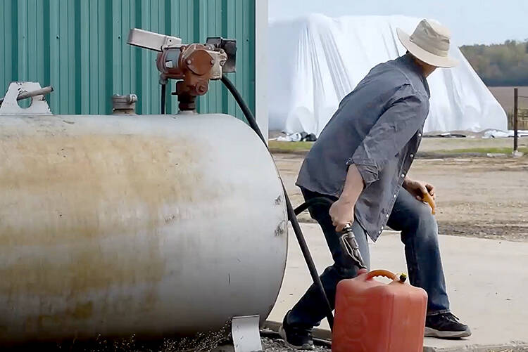 An actor demonstrates how easily someone can steal fuel without being noticed during busy season on the farm during the OPP West Region's Crime Prevention and Community Support Bureau's video discussing various steps rural property owners can take to protect their property as part of the Grey Bruce Farmers Week On-Demand session in early January.  Screengrab Image.