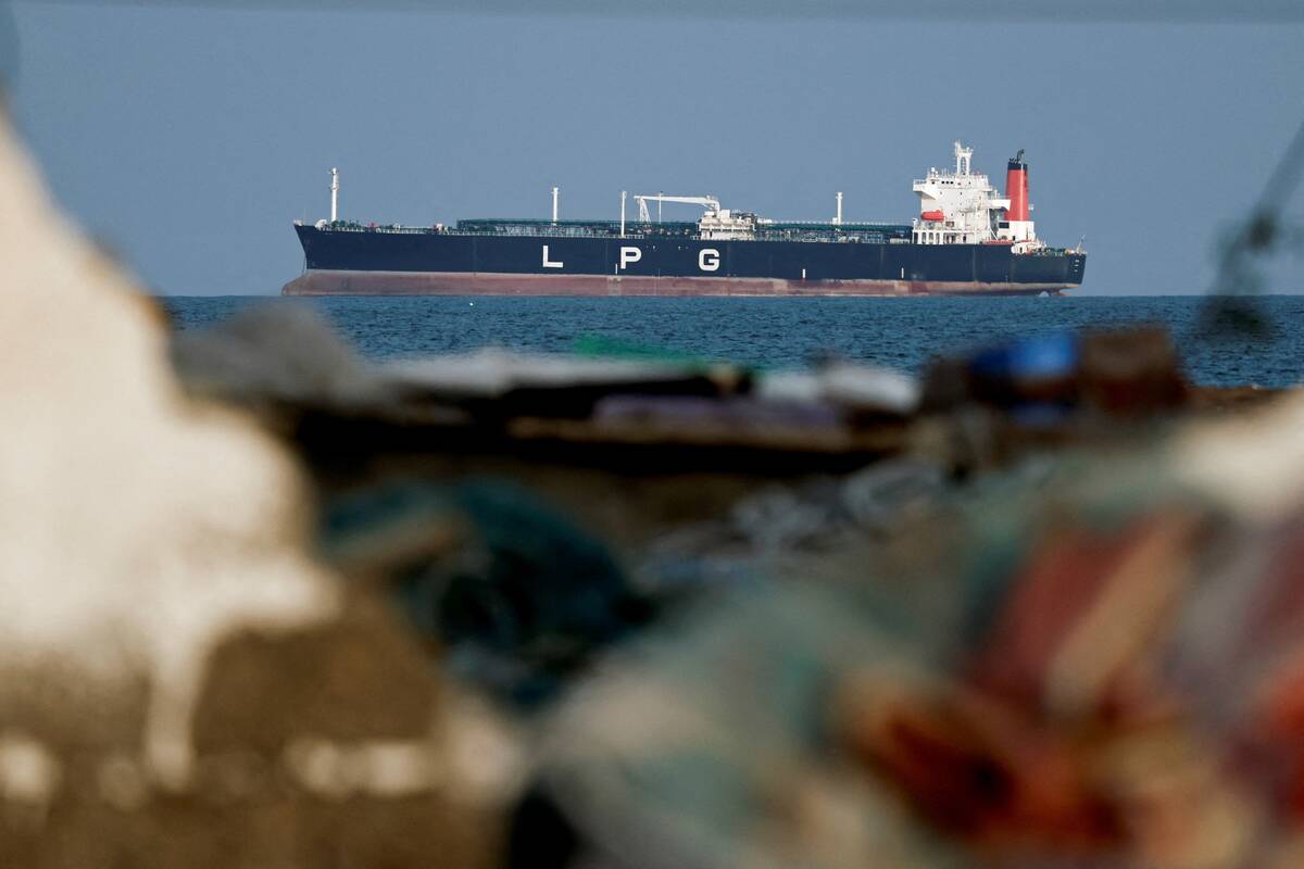 An LPG gas tanker at anchor as traffic is down in the Strait of Hormuz, amid the U.S.-Israeli conflict with Iran, in Shinas, Oman, March 11, 2026. “The Middle East war is upending lives and livelihoods in the region and beyond. It has already triggered one of the largest disruptions to global energy markets in modern history,” said the World Bank, International Monetary Fund and the U.N. World Food Programme. Photo: REUTERS/Benoit Tessier
