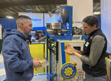 Devon Clark of St. Marys learns about on farm oil-press technology from Energrow president and CEO Jasmin Hofer at the 42 annual Drayton Farm Show. Photo: Sarah McGoldrick