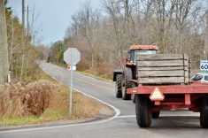 A tractor and wagon on an Ontario road. Photo: Bob Hilscher/iStock/Getty Images Plus